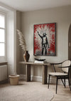 Een kamer met beige muren is voorzien van een CollageDepot magnetisch ophangsysteem met hun ingelijste kunstwerk, "Artistieke Man Schilderij", dat een persoon afbeeldt met een arm omhoog op een rood-witte achtergrond. De ruimte omvat een houten tafel met een vaas met pampagras en een kom, een zwarte stoel met een rotan zitting en een geweven rond tapijt.,Zwart